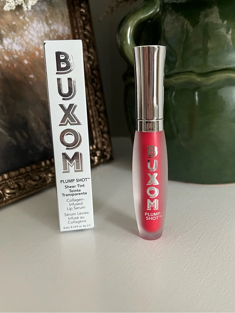 Buxom Plump Shot Sheer Tint Collagen Infused Lip Serum in shade cherry pop.
